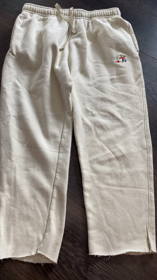 Nike medium.. bottoms have been cut, still normal length